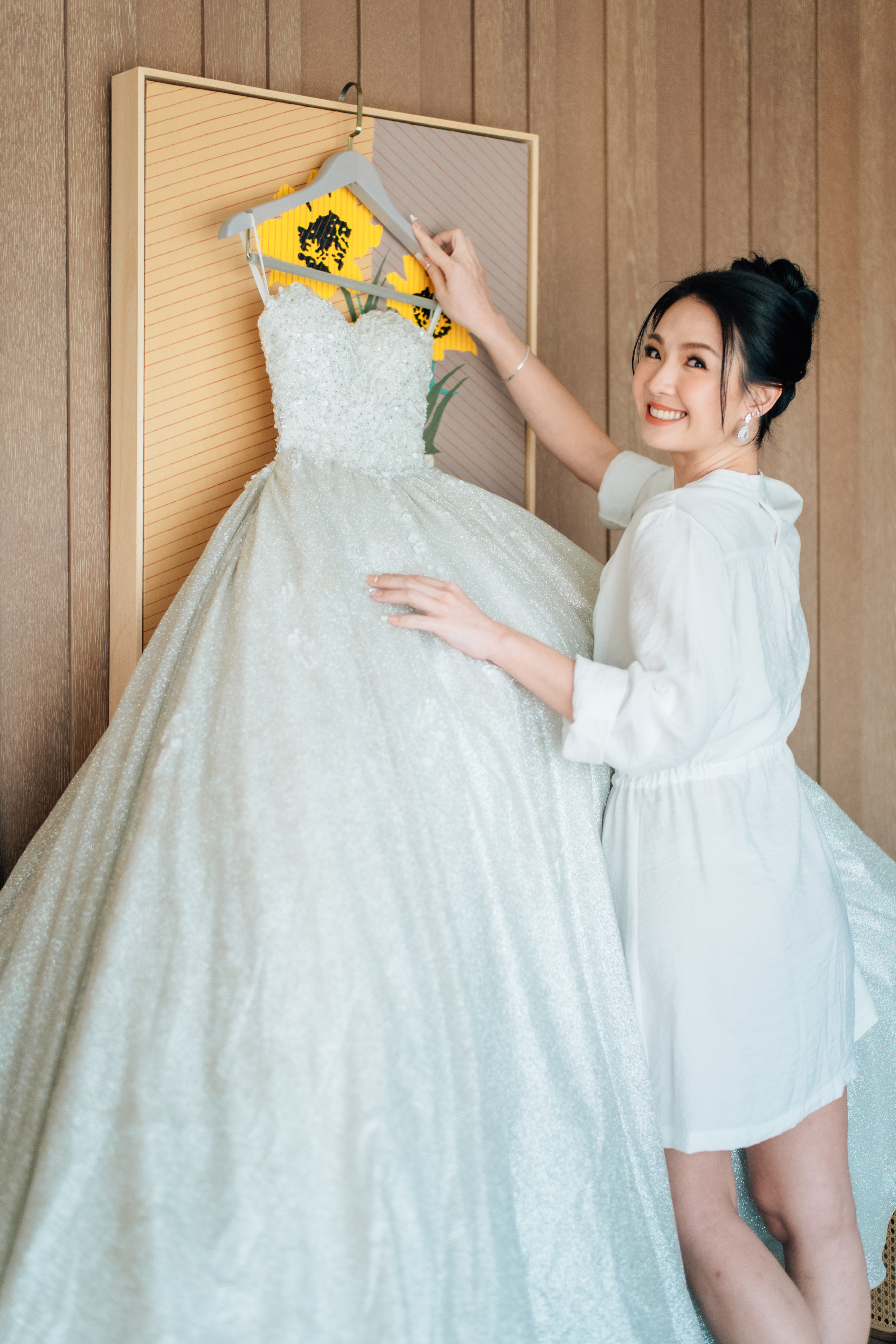 Radiant bride smiling toward the camera with fresh glam