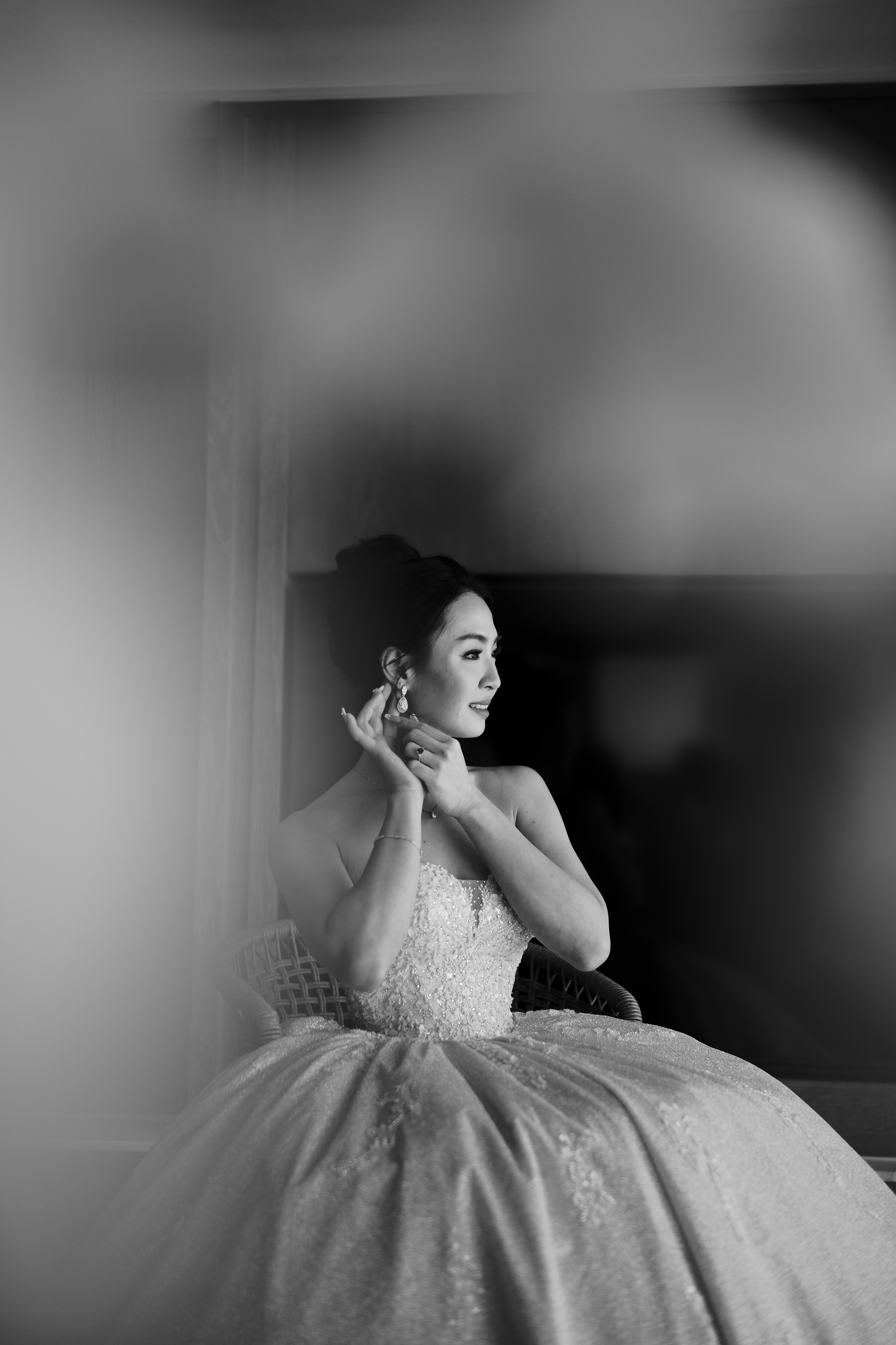 Soft glam bridal portrait with a sleek low bun