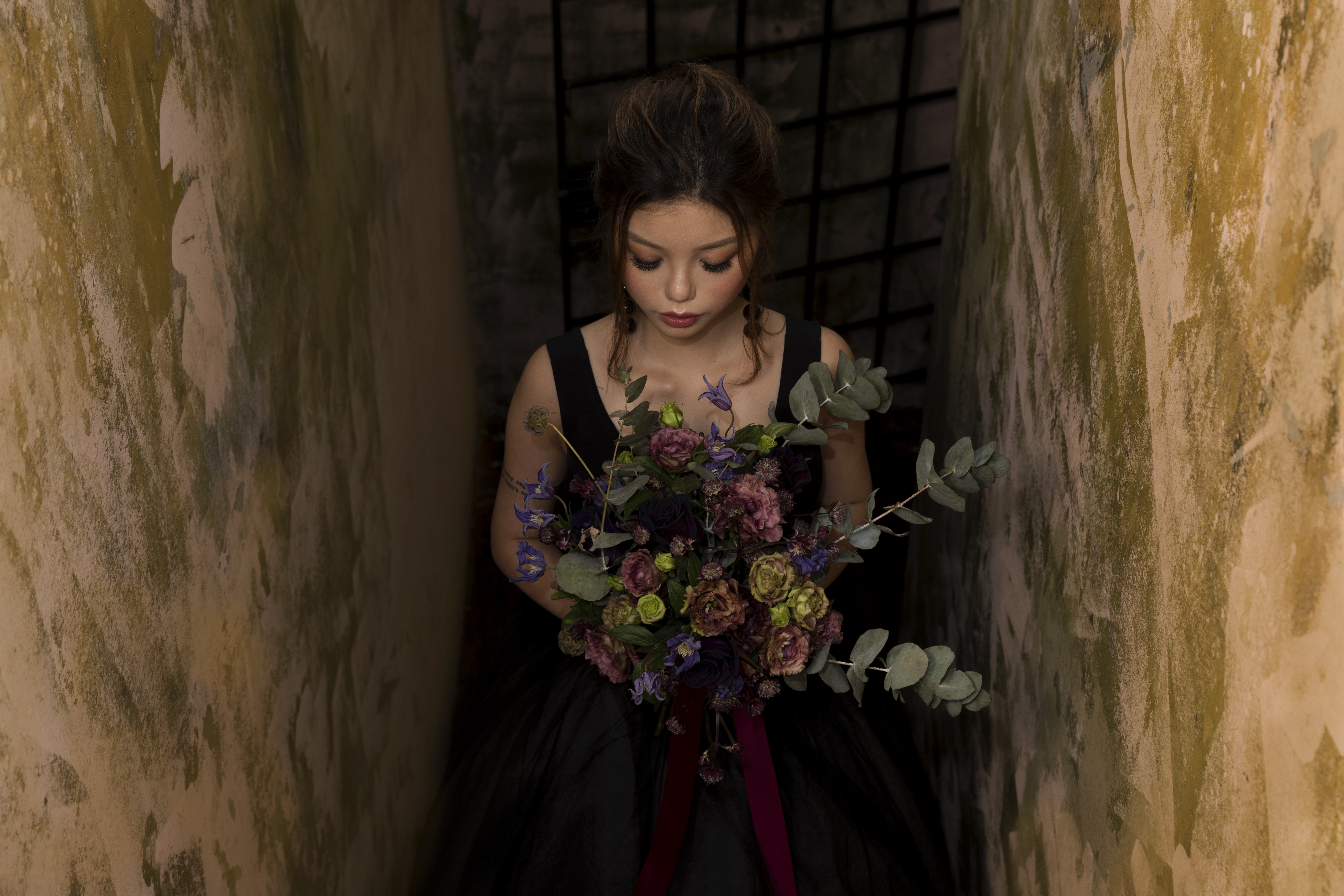 Bride laughing with glossy waves and pearl earrings